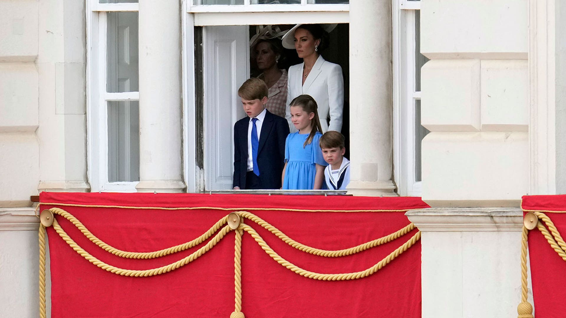 Kate, George, Charlotte, and Louis watch parade