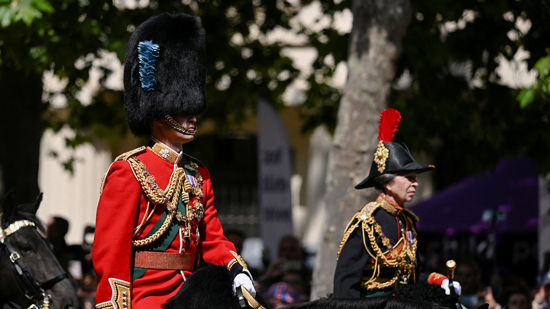 William and Anne ride horseback during Trooping