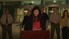 Slain LA area police officers were 'ambushed' by 'coward' while 'trying to keep a family safe,' officials say