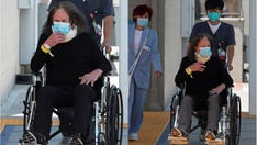 Ozzy Osbourne, 73, 'feeling good' as he leaves hospital in a wheelchair with wife Sharon after 'major' surgery