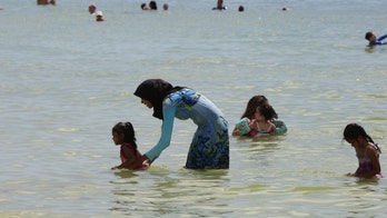 French court bans burkinis, doesn't block city allowing topless women in public swim areas