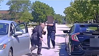 Chicago-area officer fatally shoots suspect who ran at him with a hatchet, shocking video shows