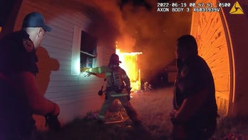 Wisconsin 3-year-old rescued from burning mobile home, police bodycam shows