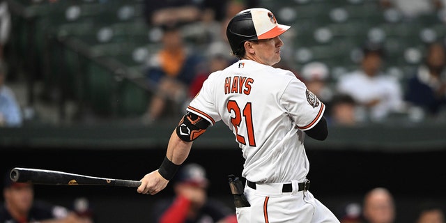Baltimore Orioles' Austin Hays follows through on a single against the Washington Nationals during the first inning of a baseball game Wednesday, June 22, 2022, in Baltimore.