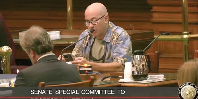 A Texas resident speaks to the Senate Special Committee to Protect All Texans during a public comments section of a 12-hour hearing.