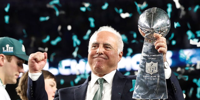 Philadelphia Eagles owner Jeffrey Lurie celebrates with the Vince Lombardi Trophy after winning Super Bowl LII in 2018.  