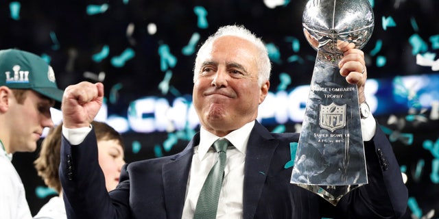 Philadelphia Eagles owner Jeffrey Lurie celebrates with the Vince Lombardi Trophy after winning Extremely Bowl LII in 2018. 