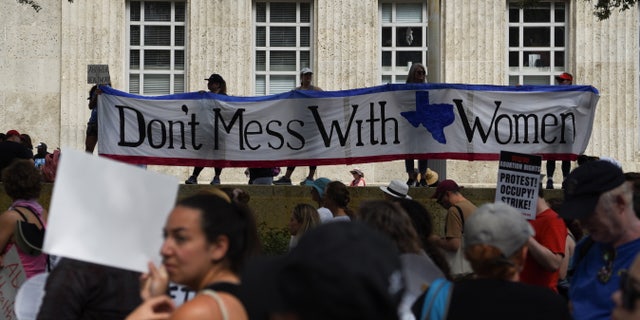 Abortion rights protesters participate in nationwide demonstrations following the leaked Supreme Court opinion suggesting the possibility of overturning the Roe v. Wade abortion rights decision, in Houston, Texas, U.S., May 14, 2022.