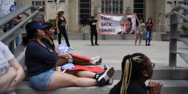 Abortion rights protesters participate in demonstrations in Houston, Texas.