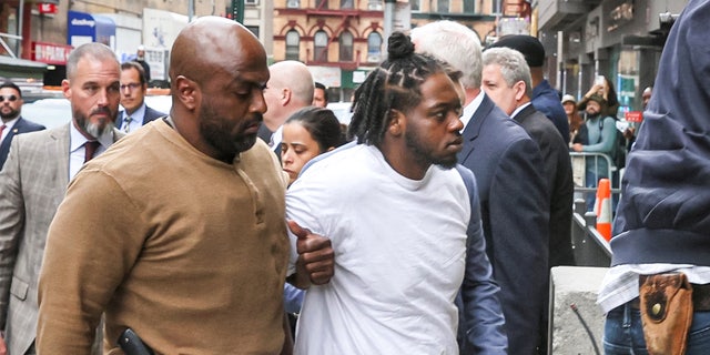 New York Subway shooting suspect Andrew Abdullah is escorted by New York City Police Detectives in to a Police Precinct in New York City, U.S., May 24, 2022.  