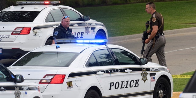 Emergency personnel work at the scene of a shooting at the Saint Francis hospital campus, in Tulsa, Oklahoma, June 1, 2022.