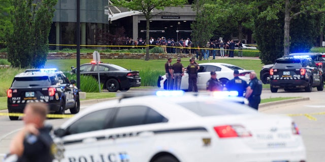 Emergency personnel work at the scene of a shooting at the Saint Francis hospital campus, in Tulsa, Oklahoma, June 1, 2022.   