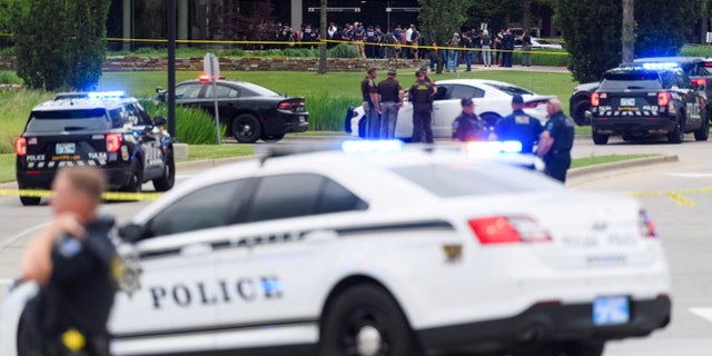 Emergency personnel work at the scene of a shooting at the Saint Francis hospital campus, in Tulsa, Oklahoma, June 1, 2022.   