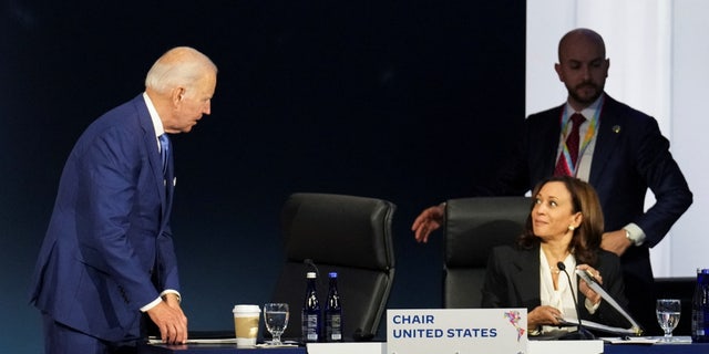 U.S. President Biden speaks with Vice President Kamala Harris during the opening session at the Ninth Summit of the Americas in Los Angeles June 9, 2022.