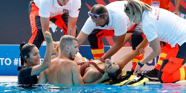 Coach rescues US artistic swimmer after she faints in pool during World  Championships | Fox News