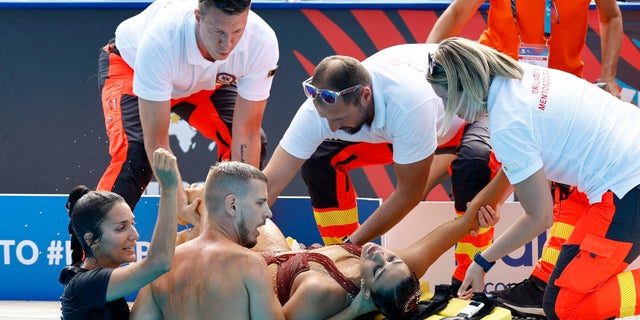 Anita Alvarez of America receives medical aid during the women's singles free final at the FINA World Championships in Budapest, Hungary on June 22, 2022