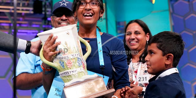 Harini Logan, 14, from San Antonio, Texas, celebrates winning the Scripps National Spelling Bee 