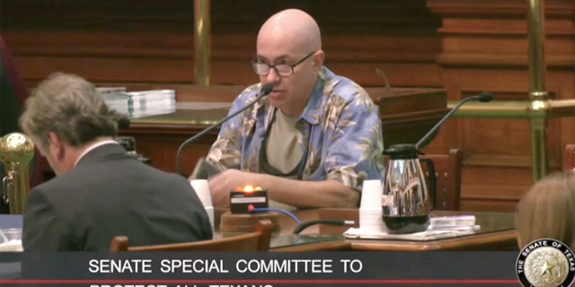 A Texas resident speaks to the Senate Special Committee to Protect All Texans during a public comments section of a 12-hour hearing.