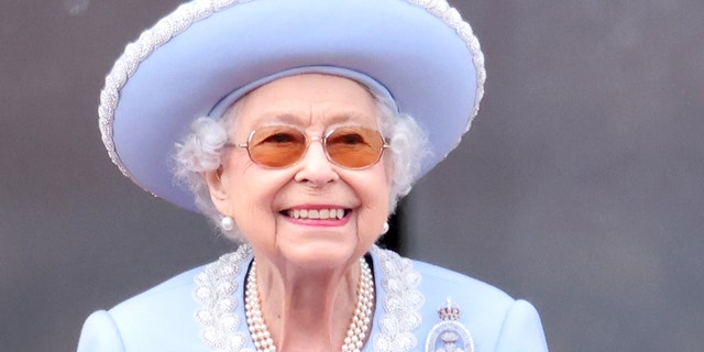 Queen Elizabeth II smiles on the balcony during Trooping The Colour during her Platinium Jubilee celebration on June 2, 2022, which was held in London.