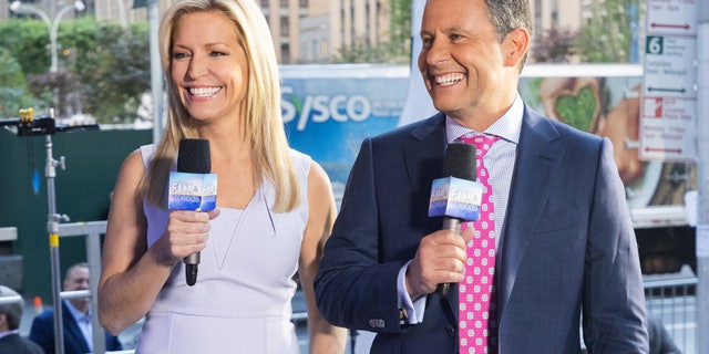 Ainsley Earhardt, along with cohost Brian Kilmeade, both of "Fox and Friends," on Fox Square in Midtown Manhattan this summer.