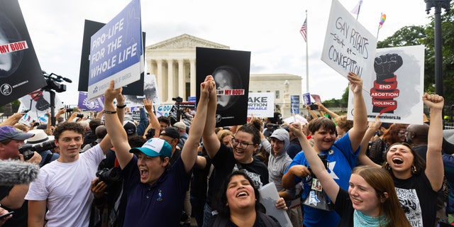 Pro-life crowd outside the court reacting to the SCOTUS decision.