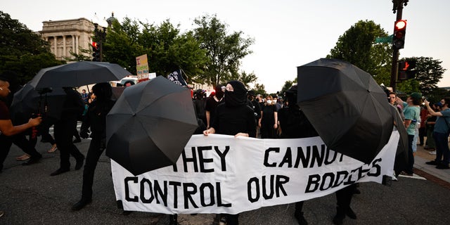 Antifa gathers outside the Supreme Court following the landmark ruling overturning Roe v. Guadare.
