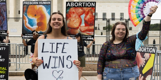 Pro-life protesters gather outside the Supreme Court.