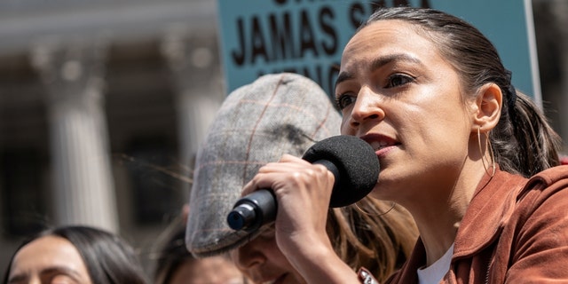 Rep. Alexandria Ocasio-Cortez speaks at a protest during International Workers Day in Foley Square in the Manhattan borough of New York City, New York, May 1, 2022. 