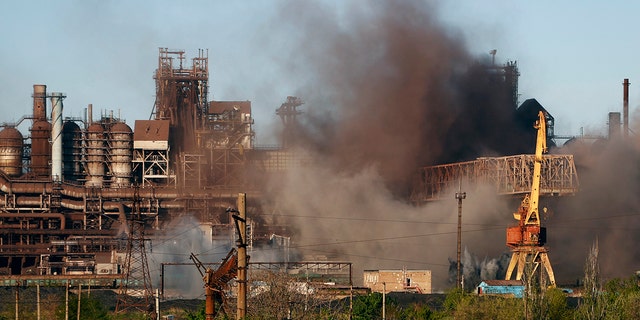 FILE - Smoke rises from the Metallurgical Combine Azovstal in Mariupol during shelling, in Mariupol, in territory under the government of the Donetsk People's Republic, eastern Ukraine, Saturday, May 7, 2022. (WHD Photo/Alexei Alexandrov, File)