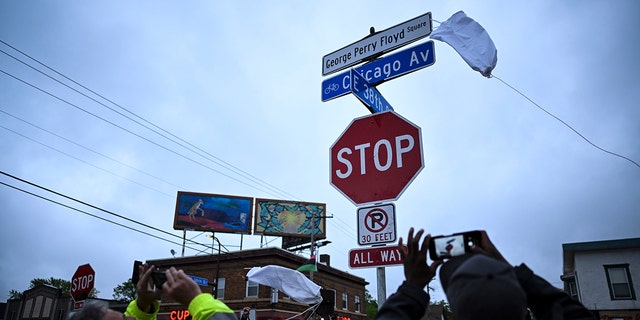 A new George Perry Floyd Square sign is unveiled in front of hundreds of community members Wednesday, May 25, 2022, in Minneapolis. The intersection where Floyd died at the hands of Minneapolis police officers was renamed in his honor Wednesday, among a series of events to remember a man whose killing forced America to confront racial injustice. 