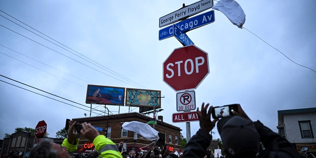 A new George Perry Floyd Square sign is unveiled in front of hundreds of community members Wednesday, May 25, 2022, in Minneapolis. The intersection where Floyd died at the hands of Minneapolis police officers was renamed in his honor Wednesday, among a series of events to remember a man whose killing forced America to confront racial injustice.