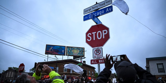 A new George Perry Floyd Square sign is unveiled in front of hundreds of community members Wednesday, May 25, 2022, in Minneapolis. The intersection where Floyd died at the hands of Minneapolis police officers was renamed in his honor Wednesday, among a series of events to remember a man whose killing forced America to confront racial injustice. 