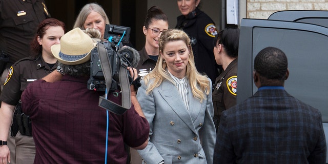 Actress Amber Heard departs the Fairfax County Courthouse Friday, May 27, 2022 in Fairfax, Va. (AP Photo/Craig Hudson)