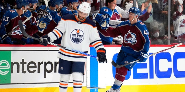 Colorado Avalanche defenseman Josh Manson (42) is congratulated for his goal against the Edmonton Oilers during the second period in Game 2 of the NHL hockey Stanley Cup playoffs Western Conference finals Thursday, June 2, 2022, in Denver. 