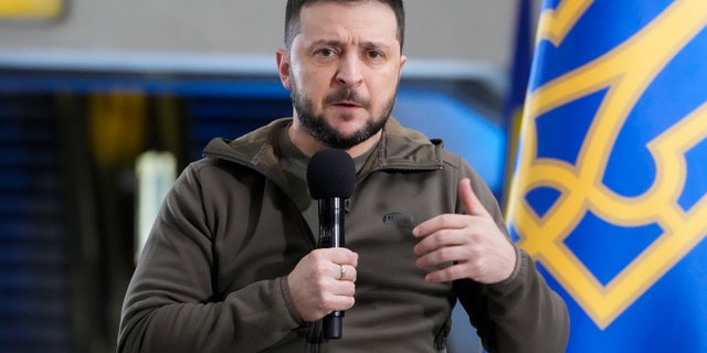 Ukrainian President Volodymyr Zelenskyy answers media questions during a press conference in a city subway under a central square in Kyiv, Ukraine, April 23, 2022.