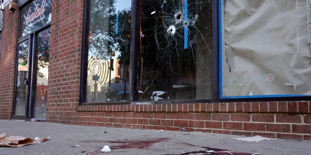 Blood is seen at the scene of a fatal overnight shooting on South Street in Philadelphia, Sunday, June 5, 2022. 