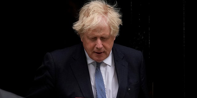 British Prime Minister Boris Johnson leaves 10 Downing Street to attend the weekly Prime Minister's Questions at the Houses of Parliament, in London, Wednesday, May 25, 2022.