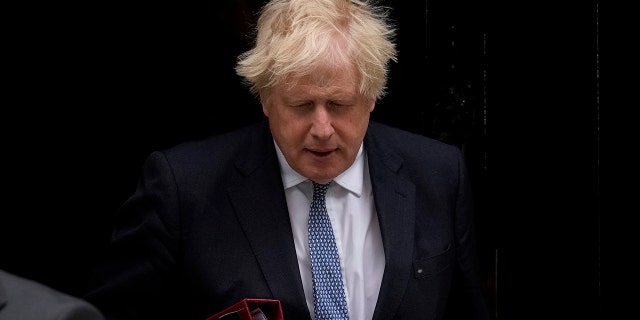 FILE - British Prime Minister Boris Johnson leaves 10 Downing Street to attend the weekly Prime Minister's Questions at the Houses of Parliament, in London, Wednesday, May 25, 2022. (AP Photo/Matt Dunham, File)