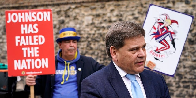British lawmaker Andrew Bridgen speaks to the media outside the Houses of Parliament on Monday.