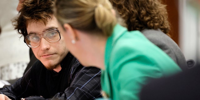 Marjory Stoneman Douglas High School shooter Nikolas Cruz listens to Assistant Public Defender Melisa McNeill at the Broward County Courthouse in Fort Lauderdale on Monday, June 6, 2022.