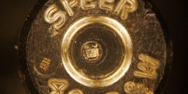 A bullet casing showing identification codes, at center, is shown through a microscope at a news conference at the Los Angeles Police Academy in 2007.