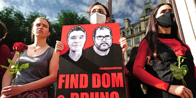 People take part in a vigil outside the Brazilian Embassy for Dom Phillips and Bruno Araujo Pereira, a British journalist and an Indigenous affairs official who are missing in the Amazon, in London, Thursday, June 9, 2022