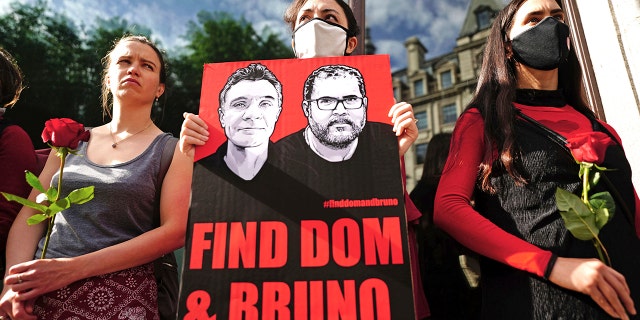 People take part in a vigil outside the Brazilian Embassy for Dom Phillips and Bruno Araujo Pereira, a British journalist and an Indigenous affairs official who are missing in the Amazon, in London, Thursday, June 9, 2022. 