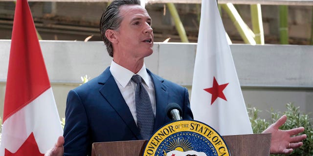 California Gov. Gavin Newsom answers questions at a news conference after signing a memorandum of cooperation on climate change with Canada's Prime Minister Justin Trudeau at the California Science Center outside of the Summit of the Americas, in Los Angeles, on Thursday, June 9, 2022.
