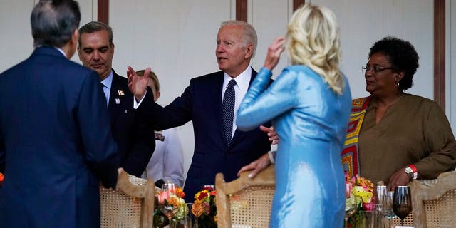 President Joe Biden talks to guests as he and first lady Jill Biden host a dinner during the Summit of the Americas, Thursday, June 9, 2022, in Los Angeles. (AP Photo/Evan Vucci)