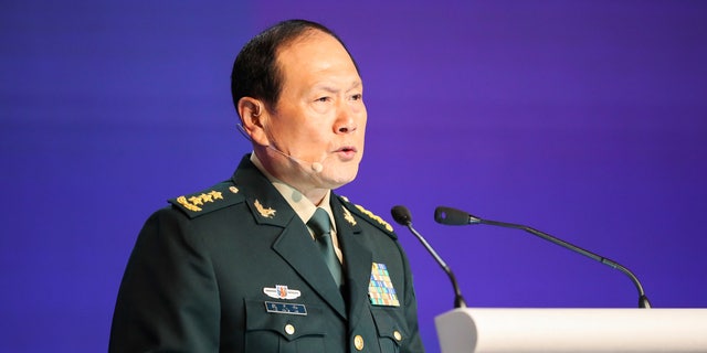 China's Defense Minister General Wei Fenghe speaks at a plenary session during the 19th International Institute for Strategic Studies (IISS) Shangri-la Dialogue, Asia's annual defense and security forum, in Singapore, Sunday, June 12, 2022. (AP Photo/Danial Hakim)