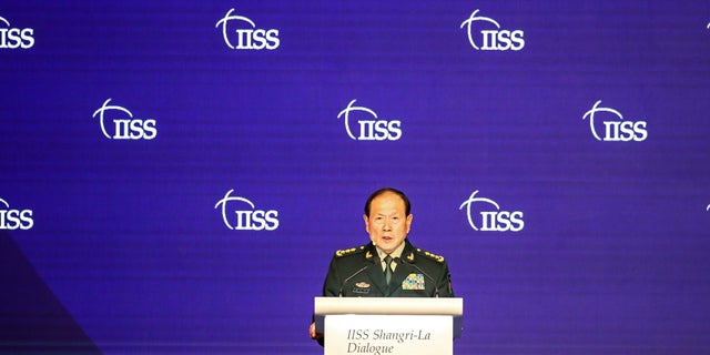 China's Defense Minister General Wei Fenghe speaks at a plenary session during the 19th International Institute for Strategic Studies (IISS) Shangri-la Dialogue, Asia's annual defense and security forum, in Singapore, Sunday, June 12, 2022. (AP Photo/Danial Hakim)