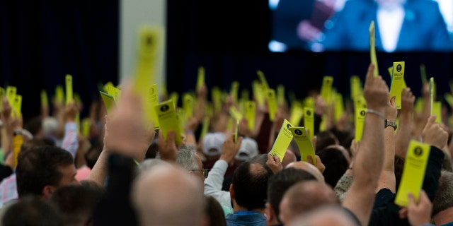 Attendees will hold ballots during a session at the Southern Baptist Convention's Annual Meeting in Anaheim, CA on Tuesday, June 14, 2022.