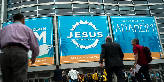 Attendees arrive at the Southern Baptist Convention's annual meeting in Anaheim, California, on June 14, 2022.