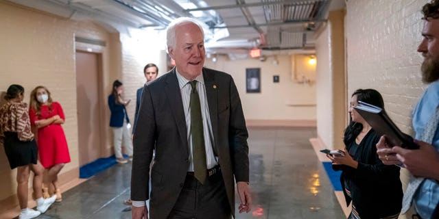 Sen. John Cornyn, R-Texas, arrives to meet with Sen. Chris Murphy, D-Conn., and Sen. Kyrsten Sinema, D-Ariz., arrive for more bipartisan talks on how to rein in gun violence, at the Capitol in Washington, Wednesday, June 15, 2022. 